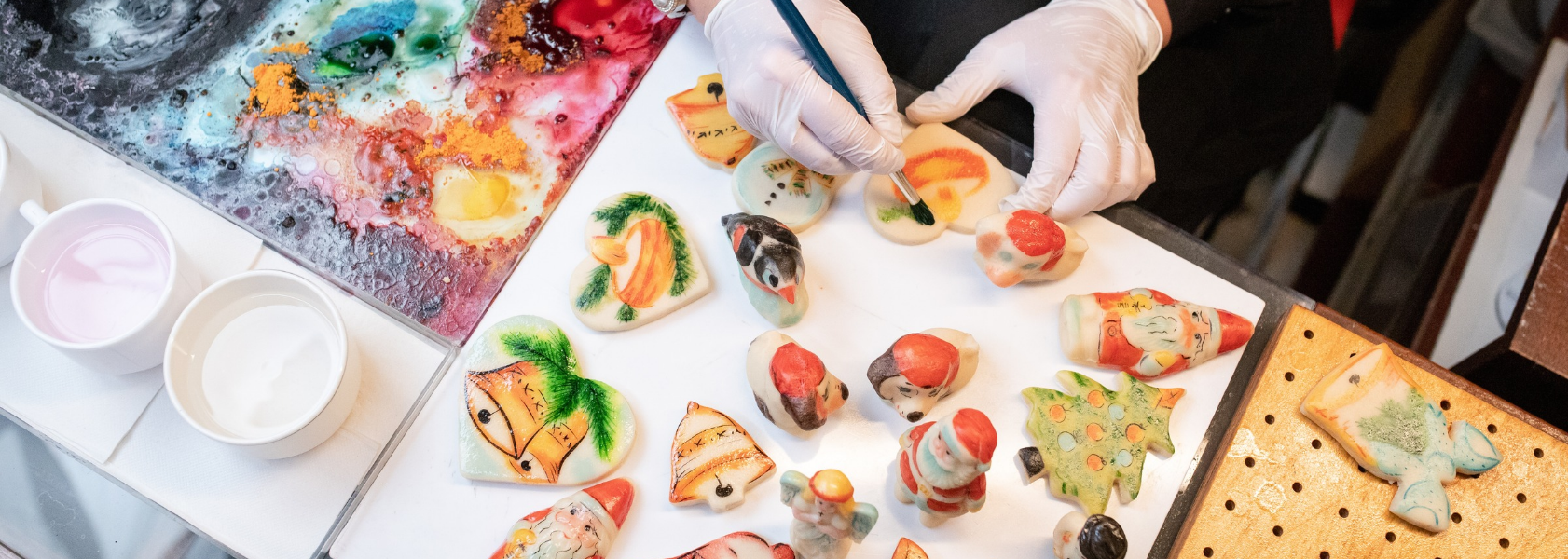Hand-painted marzipan figurines on a table at a marzipan workshop in Tallinn