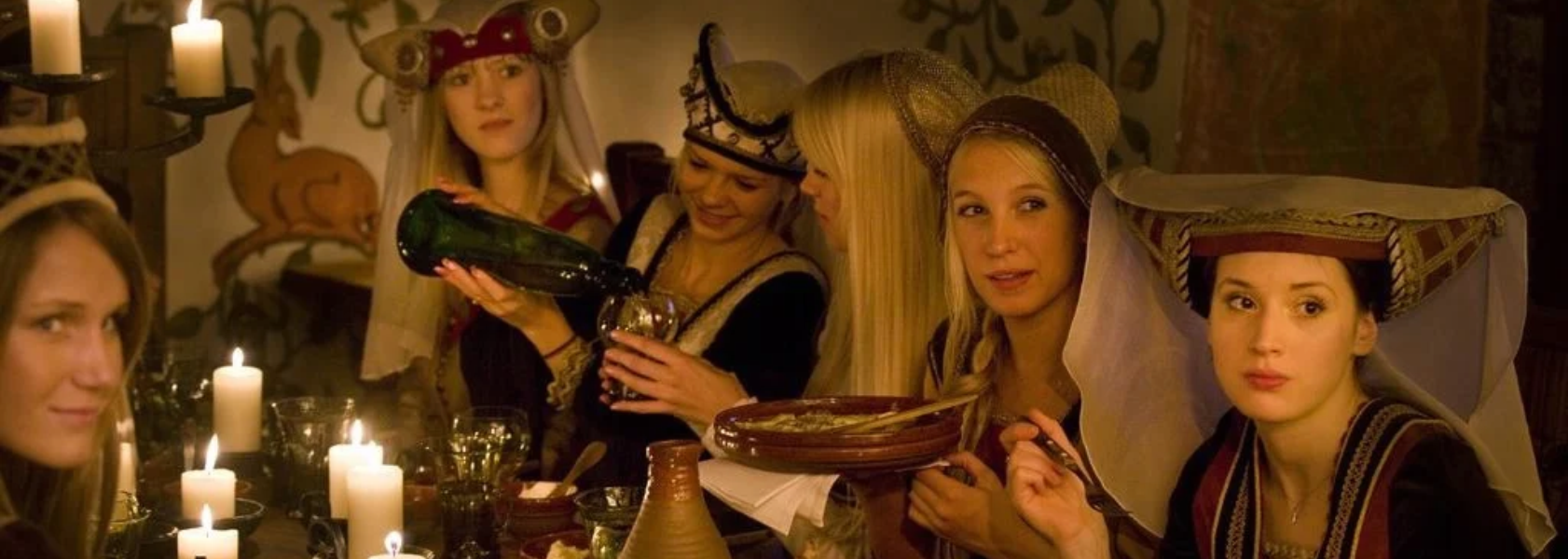Guests in medieval costume dining by candlelight at Olde Hansa in Tallinn Old Town